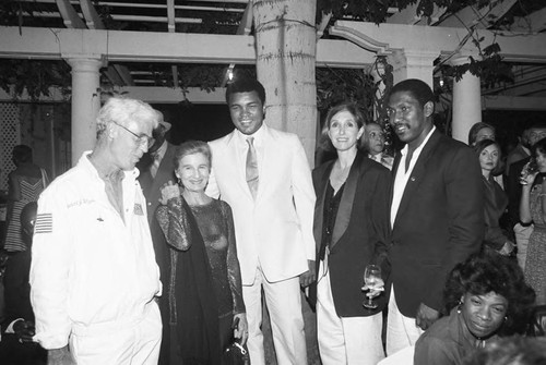 Muhammad Ali talking with guests at an Olympic Arts Festival cast party, Los Angeles, 1984