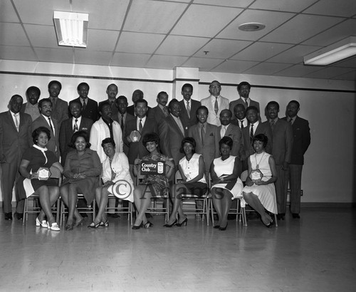 Group of men and women holding awards, Los Angeles, 1970