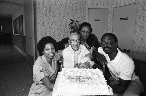 Mamie Smoot celebrating her 100th birthday with family, Los Angeles, 1983