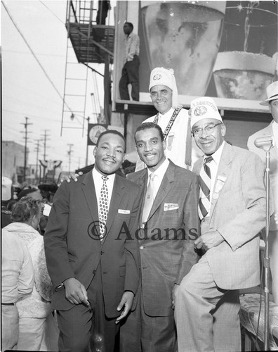 Rev. Dr. Martin Luther King Jr. posing with Hobson R. Reynolds and others, Los Angeles, 1956