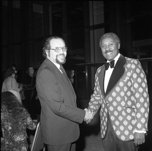 Dr. Kenneth Washington poses with Nate Holden at an event for Tom Bradley, Los Angeles, 1974