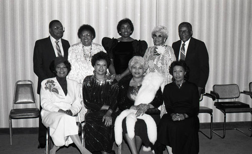 African American men and women posing together at a formal event, Los Angeles, 1987