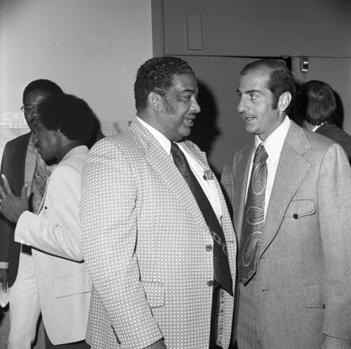 Bob Moretti speaking with Celes King III at the California Black Elected Officials Conference, Los Angeles, 1973