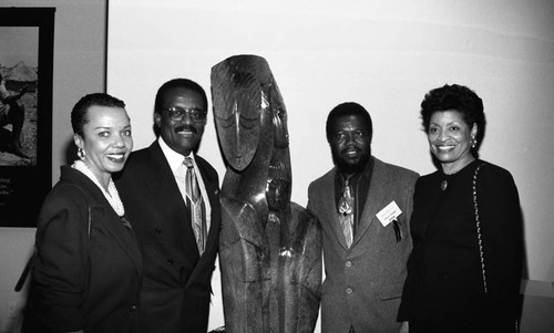 Johnnie Cochran Jr., posing with others at the "Spirits in Stone" exhibit, Los Angeles, 1995 Los Angeles, 1995