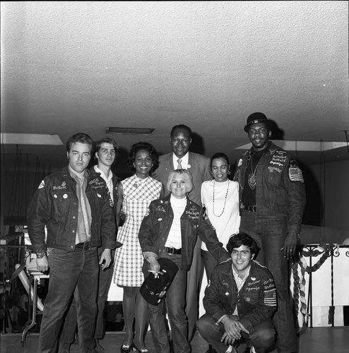 Tom Bradley and Yvonne Brathwaite Burke posing with campaign organizers, Los Angeles, 1969