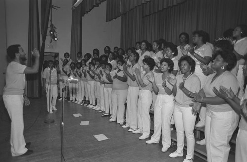 Jefferson High School choir alumni singing together during a reunion, Los Angeles, 1983