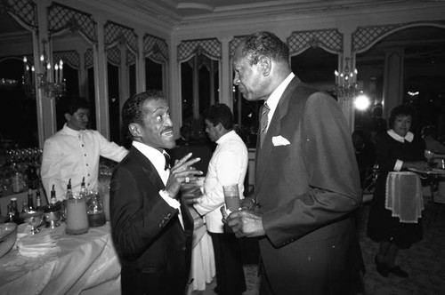 Sammy Davis Jr. talking with Tom Bradley at the Black Emmy nominees dinner, Los Angeles, 1989
