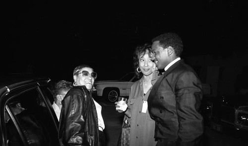 Donnie Simpson talking with women at the 11th Annual BRE Conference, Los Angeles, 1987