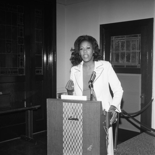 Woman at Podium, Los Angeles, 1975