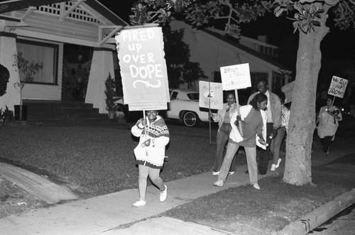 Neighborhood watch group marching against drugs and crime, Los Angeles, 1986