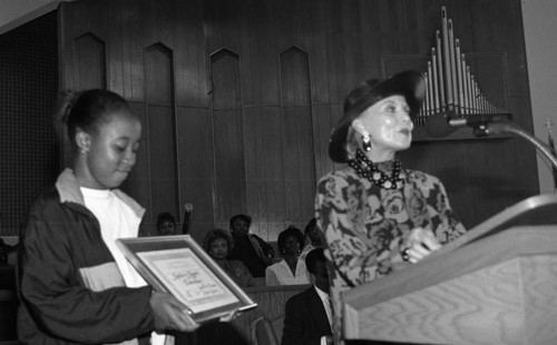 Young woman receiving an award during a "Youth on Parade" event, Los Angeles, 1993