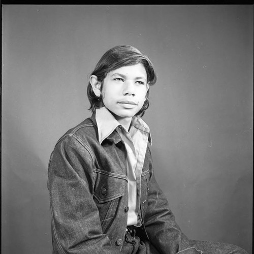 Larry Aubry's son posing for a studio portrait, Los Angeles