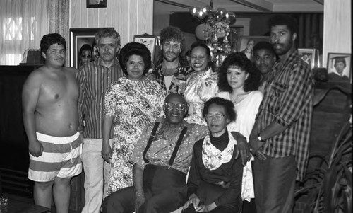 Mary Copeland and her husband posing with family on her wedding anniversary, Los Angeles, 1989