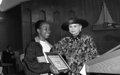 Young woman receiving at award during a "Youth on Parade" event, Los Angeles, 1993