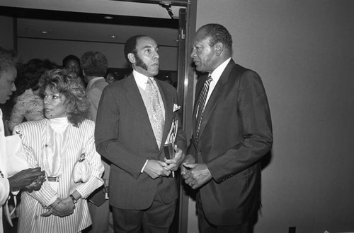 Black Enterprise Magazine's Earl G. Graves talking with Tom Bradley, Los Angeles, 1987