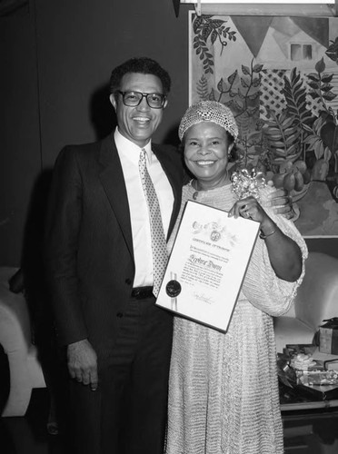 Zephra Dunn receiving a certificate during a reception celebrating her retirement, Los Angeles, 1983