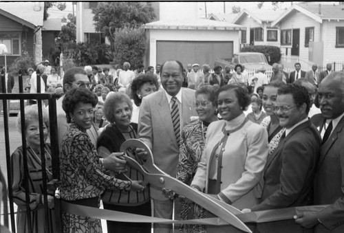 Tom Bradley and others cutting a ribbon at the Delta Sigma Theta Senior Center, Los Angeles, 1987