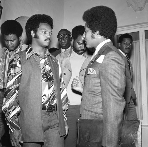 Rev. Jesse Jackson and John Williams talking together, Los Angeles