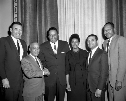 Don Newcombe posing with Burnistine McClaney and Los Angeles city council members , Los Angeles, 1967