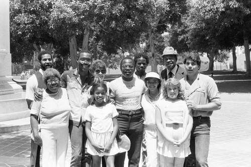 Rev. Bill Minson, Kim Fields and others posing together near L.A. City Hall, Los Angeles, 1983