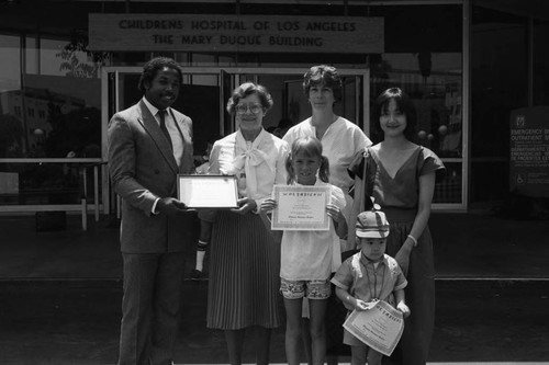 Children's Hospital event participants posing together, Los Angeles, 1984