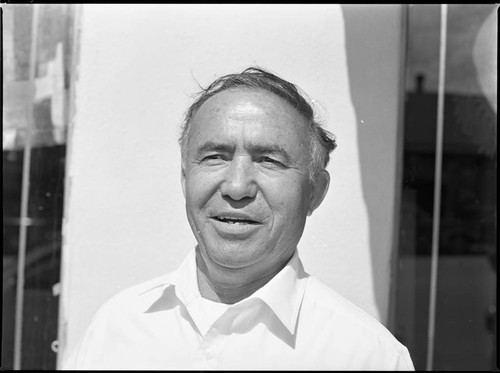 Charles Coranado posing near a storefront, Los Angeles, 1983