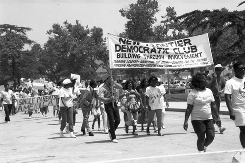 Community organizations walking with banners at the Black Family Reunion, Los Angeles, 1989