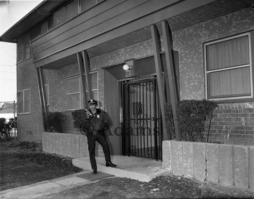 Police outside building, Los Angeles, 1976