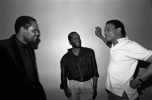 Al Jarreau and George Howard talking together at the 11th Annual BRE Conference, Los Angeles, 1987