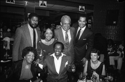 Lou Rawls posing with Reve Gipson and others at the Pied Piper nightclub, Los Angeles, 1984