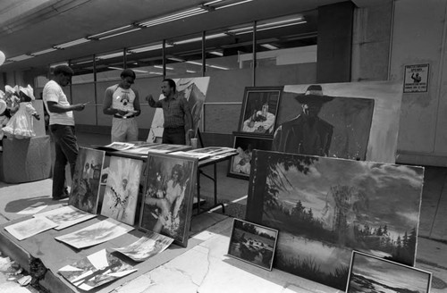 Crenshaw Festival participant displaying artwork, Los Angeles, 1983