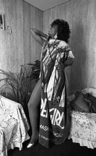 Deborah Burrell posing with a banner form the musical Dreamgirls, Los Angeles, 1983