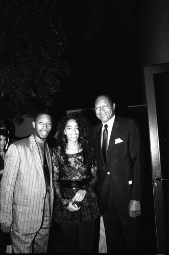 Jeffrey Osborne, Jody Watley, and Tom Bradley posing together at the 11th Annual BRE Conference, Los Angeles, 1987