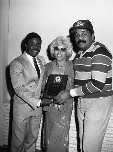 Reginald Dorsey posing with Dora Alverez at the Pied Piper Club, Los Angeles, 1984