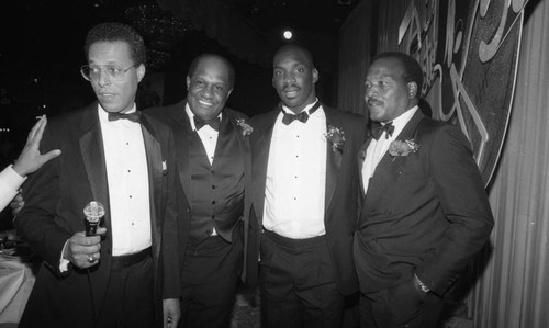 Doug Williams posing with Jim Brown and Willie Davis at a 100 Black Men tribute, Los Angeles, 1988