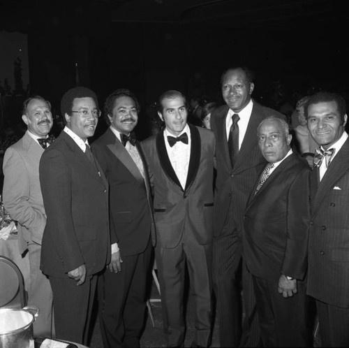 Bob Moretti posing with Tom Bradley, Mervyn Dymally and others during a special event, Los Angeles, 1973