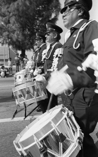 Drummers playing during a parade, 1982