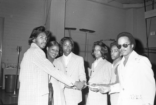 Performers receiving a check at KGFJ's Soul Search event, Los Angeles, 1975