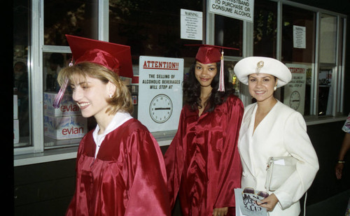 Nicole Bailey walking along a stadium corridor at her graduation, Los Angeles, 1996