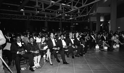 Guests of the California African American Museum exhibit "The Black Olympians" listening to a speaker, Los Angeles, 1985