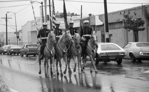 U.S. Marine Mounted Color Guard members riding in the South Central Los Angeles Easter Parade, Los Angeles, 1982