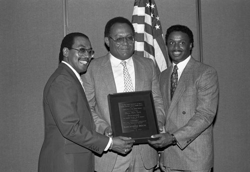 Black Enterprise Magazine luncheon participant receiving an award, Los Angeles, 1987