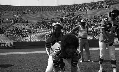 Marvin Gaye and Pam Grier playing in the Urban League's Celebrity All-Star touch football Freedom Classic pre-game, Los Angeles, 1973