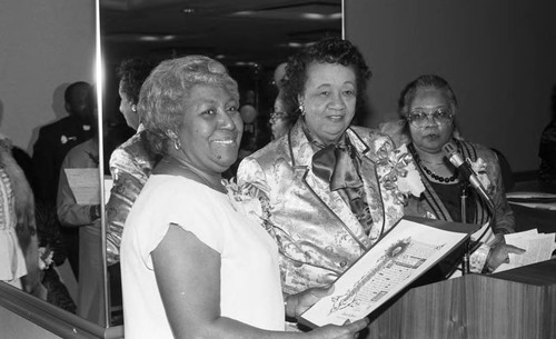 Annie G. Powell receiving an award from Dr. Dorothy Height, Los Angeles, 1989