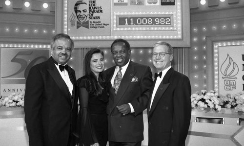 Lou Rawls posing with participants in the "Lou Rawls Parade of Stars" telethon, Los Angeles, 1994