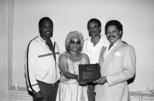 Reynaldo Rey posing with others at the Piper nightclub, Los Angeles, 1984