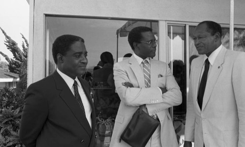 Sidney Poitier and Dr. Peter Bright-Asare talking with Tom Bradley, Los Angeles, 1983