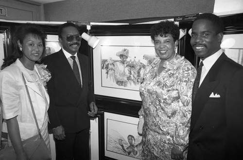 Couples posing in front of artwork at a Black Women's Scholarship event, Los Angeles, 1989