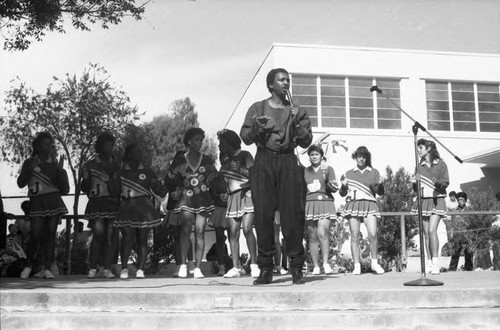 Richard "Dimples" Fields performing next to cheerleaders at Jefferson High School, Los Angeles, 1984