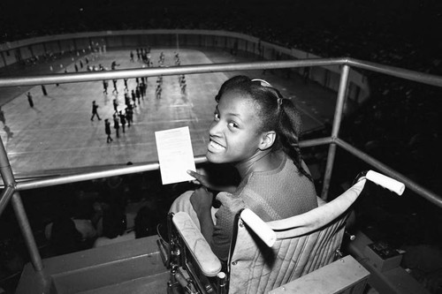 Teenager in a wheelchair watching a LAUSD Band and Drill Team Championship, Los Angeles, 1983